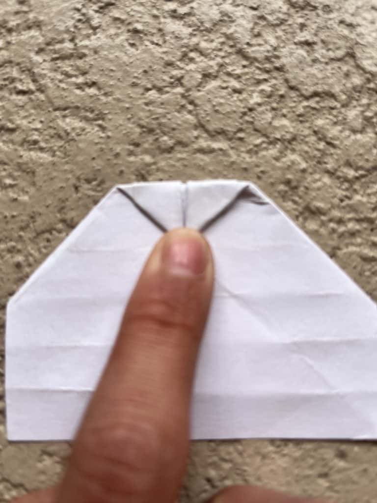 Flipped over and folding down point. Finishing point of heart in the origami heart ring.