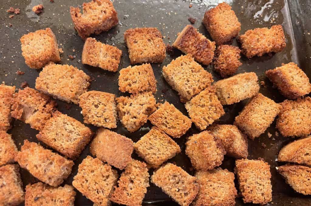 baked croutons on baking pan