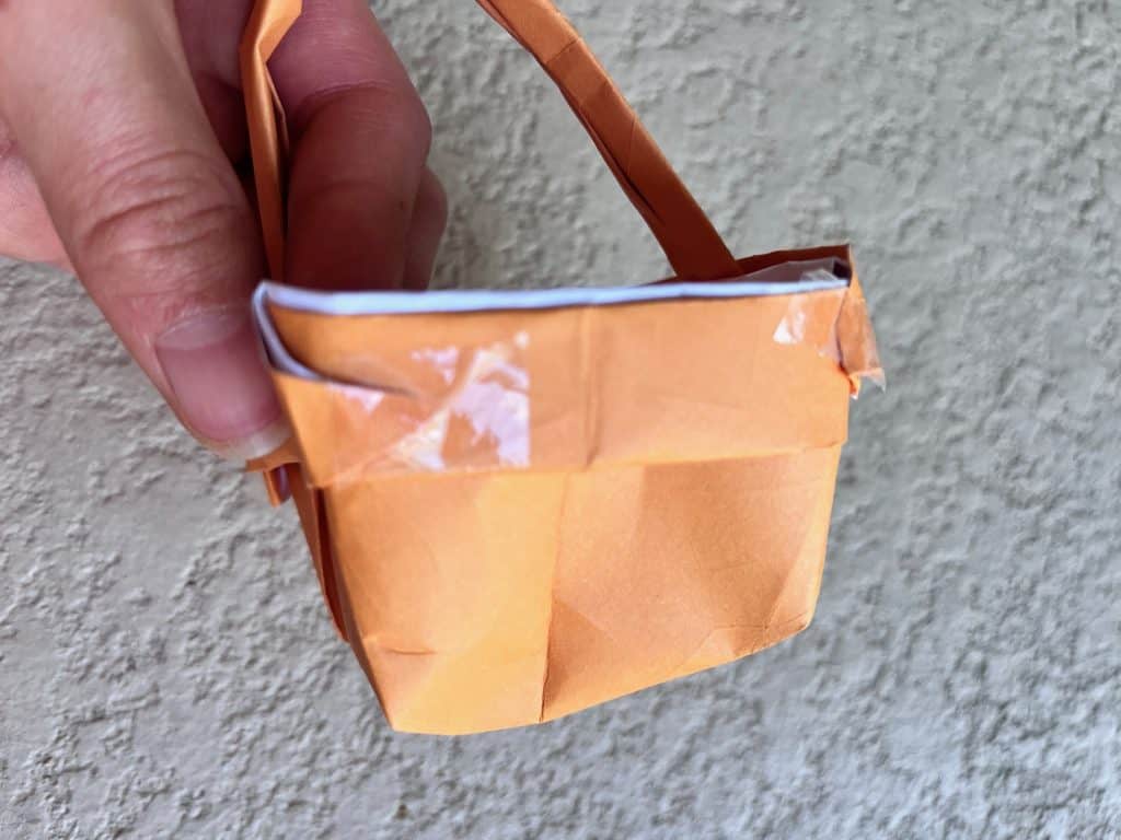 Taping corners of origami basket